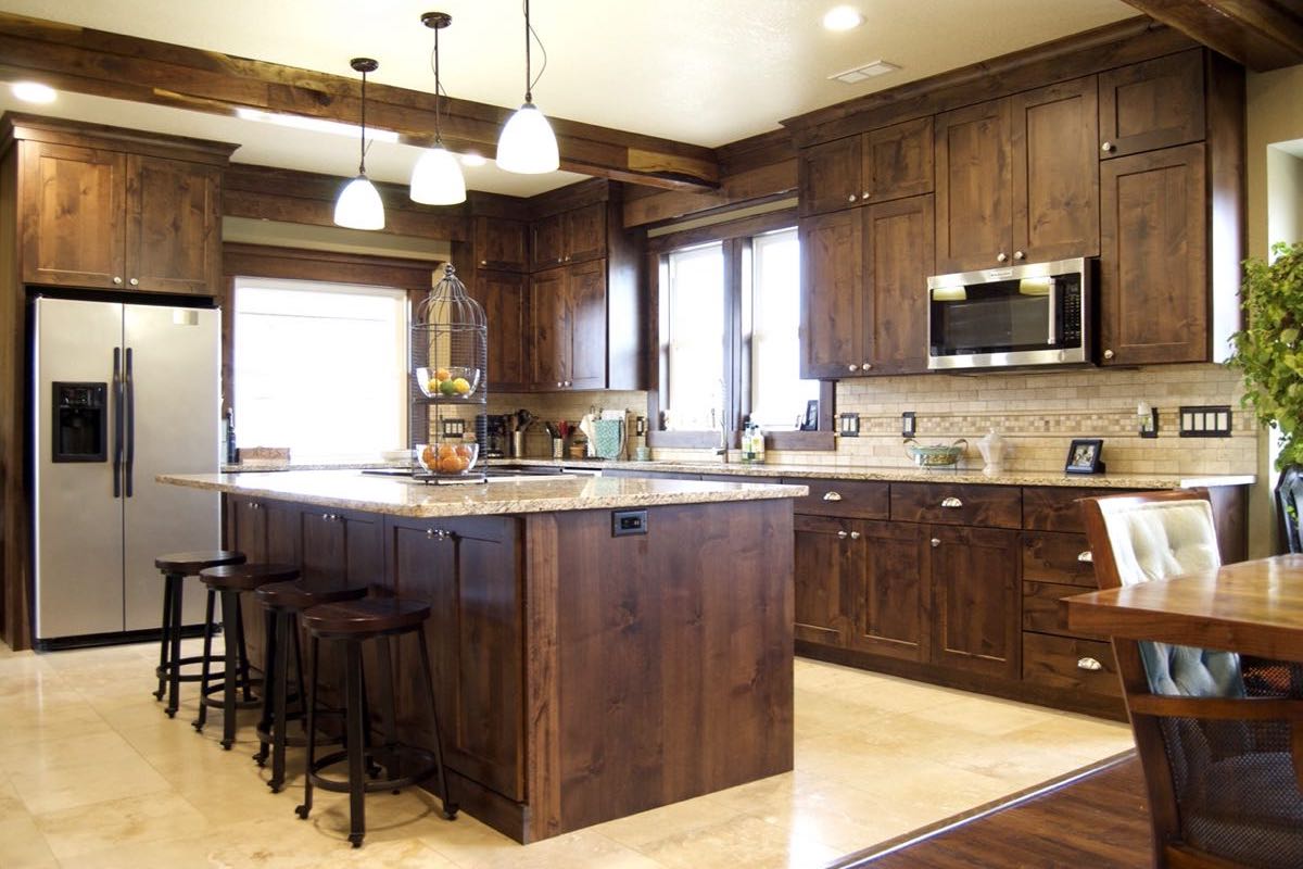 kitchen with wooden cabinets and accents and large four seater island