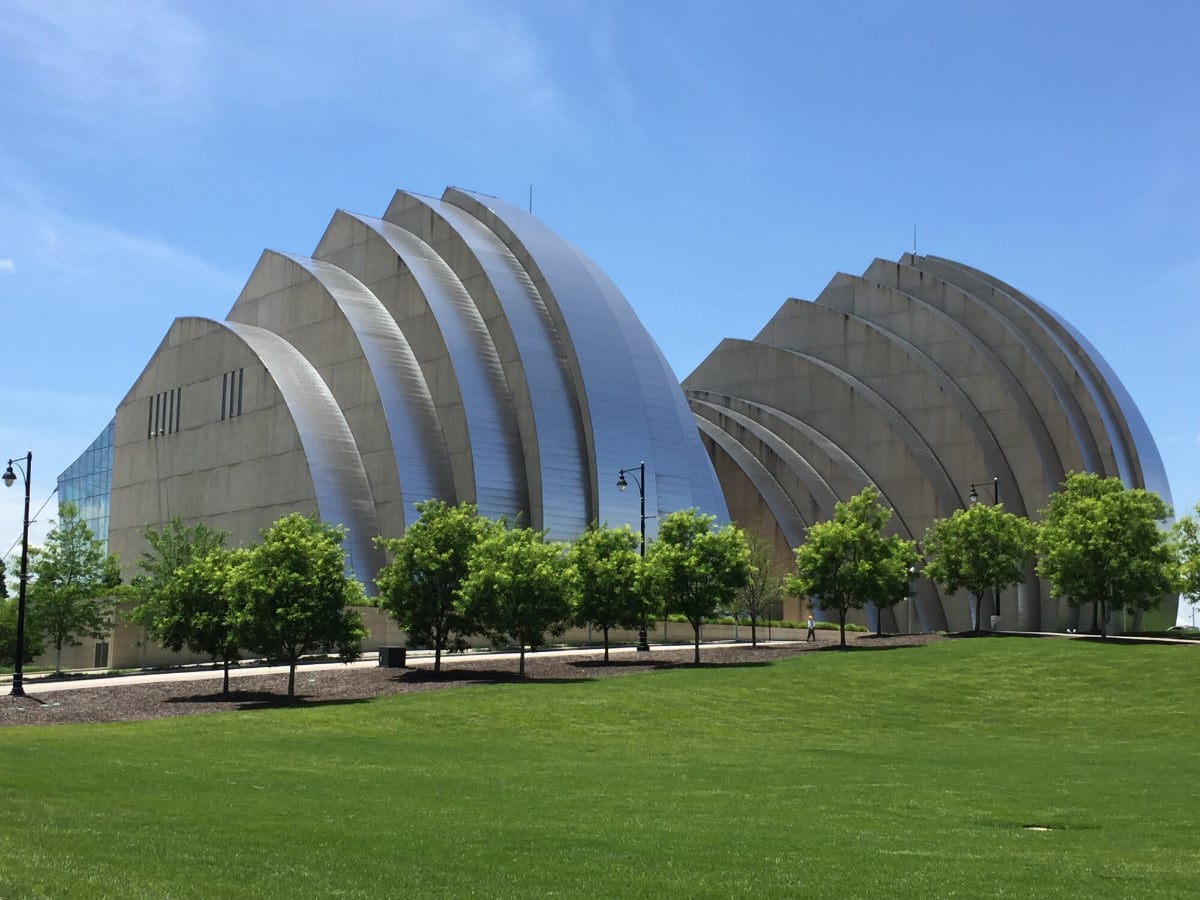 Kauffman center, large silver building with trees in front