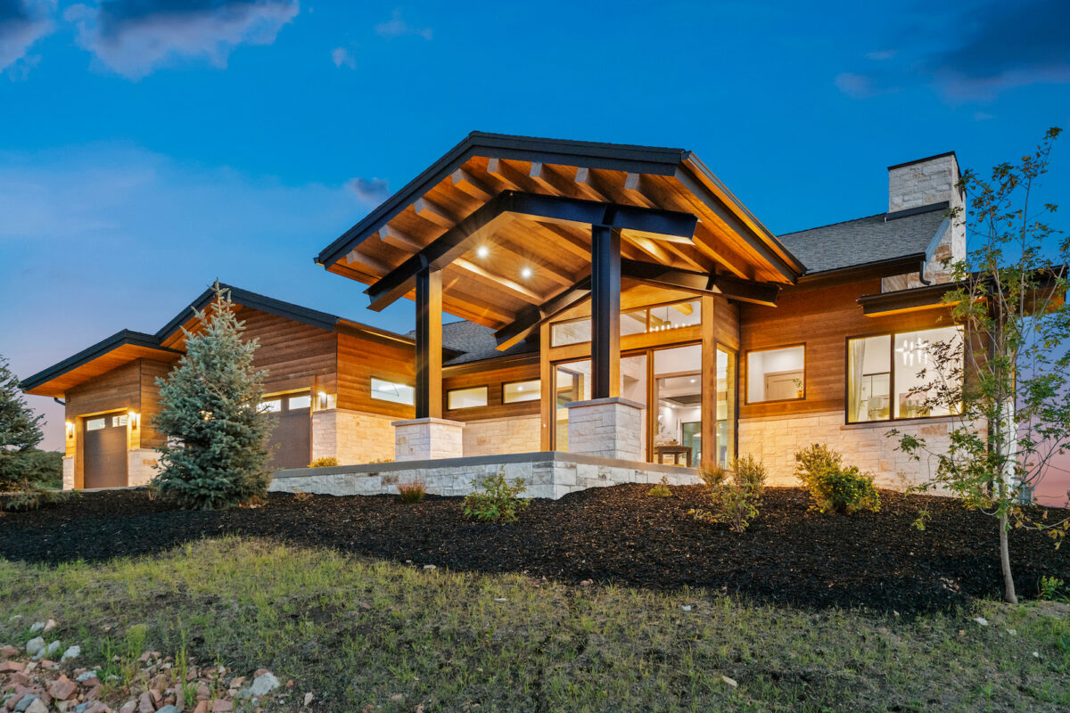 Evening exterior of Halo Crest custom mountain home in Golden Eagle, Hideout, Utah